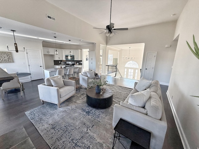 308 Griffey Ests, Clarksville, TN 37042 - living room featuring dark wood-type flooring, visible vents, baseboards, and ceiling fan with notable chandelier