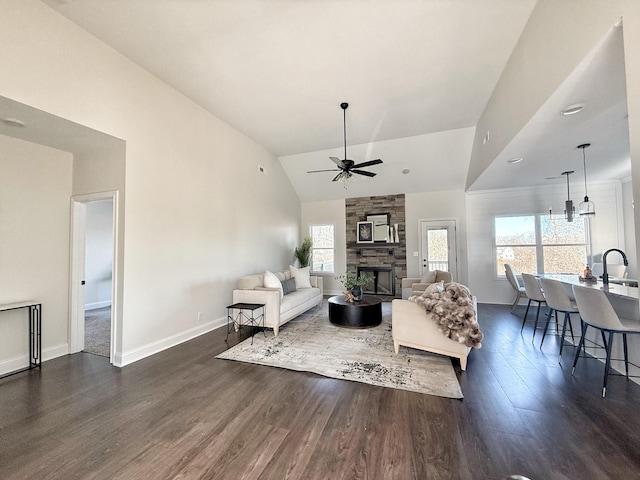 308 Griffey Ests, Clarksville, TN 37042 - living room featuring high vaulted ceiling, a ceiling fan, a stone fireplace, baseboards, and dark wood-style flooring