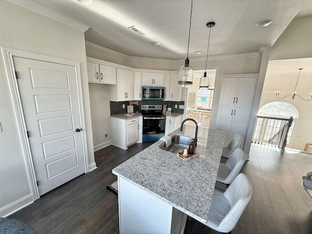308 Griffey Ests, Clarksville, TN 37042 - kitchen featuring white cabinetry, dark wood-style floors, stainless steel appliances, and a sink