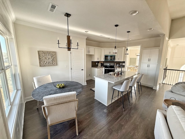 308 Griffey Ests, Clarksville, TN 37042 - kitchen with white cabinets, crown molding, stainless steel appliances, and visible vents