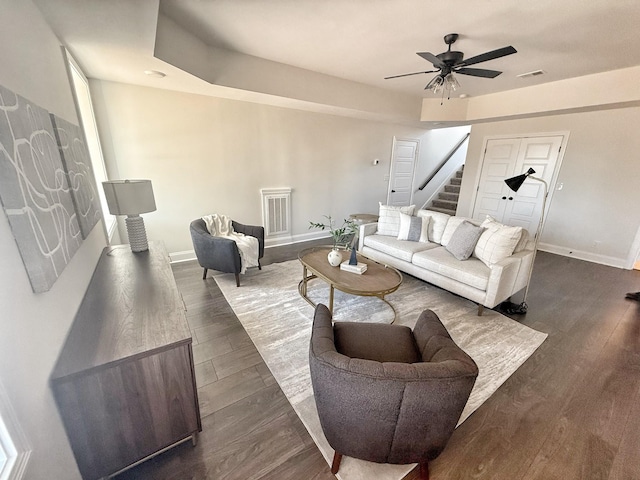 308 Griffey Ests, Clarksville, TN 37042 - living room featuring dark wood-type flooring, stairway, visible vents, and baseboards