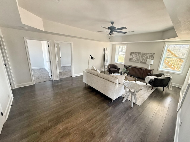 308 Griffey Ests, Clarksville, TN 37042 - living area with a ceiling fan, baseboards, dark wood-style flooring, and a tray ceiling