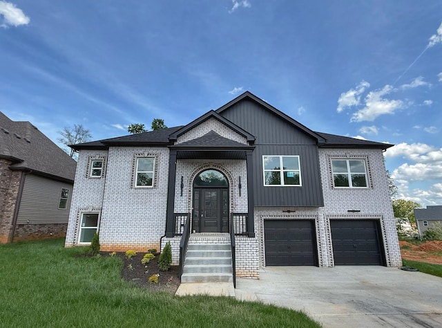 308 Griffey Ests, Clarksville, TN 37042 - bi-level home with concrete driveway, an attached garage, brick siding, and board and batten siding
