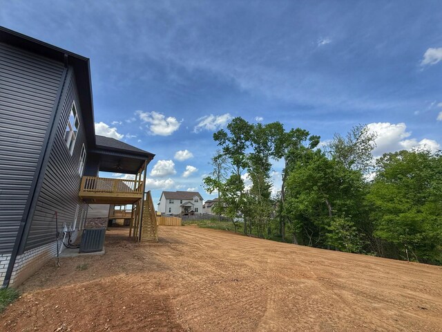 308 Griffey Ests, Clarksville, TN 37042 - view of yard featuring stairway, dirt driveway, fence, and central air condition unit