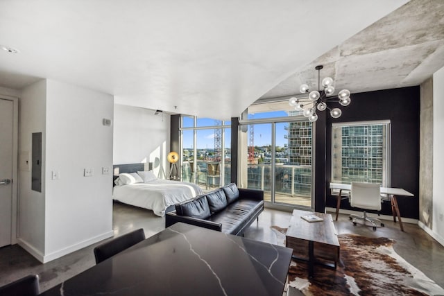 bedroom featuring floor to ceiling windows, electric panel, and a notable chandelier