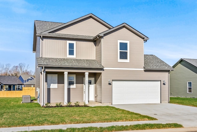 view of front of property featuring central air condition unit, a garage, covered porch, and a front yard