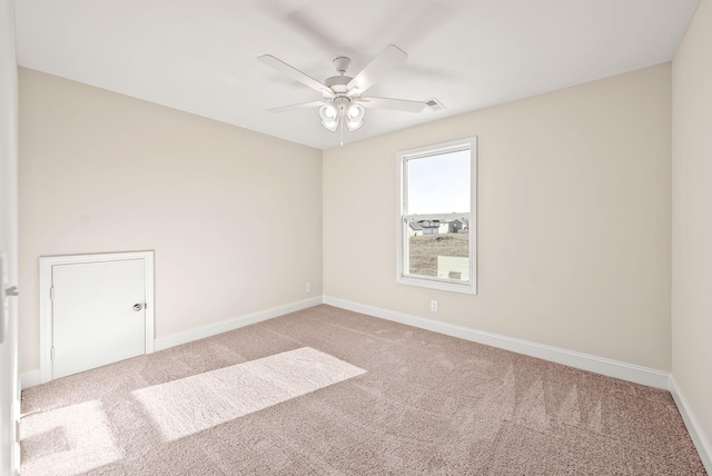 carpeted empty room with ceiling fan