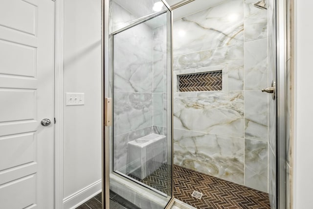 bathroom with a shower with shower door