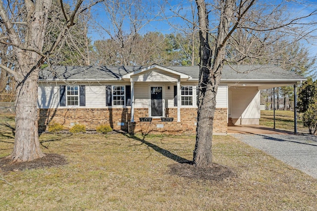 view of front facade with a carport and a front yard