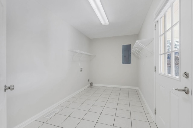 laundry area with light tile patterned floors, washer hookup, gas dryer hookup, and electric panel