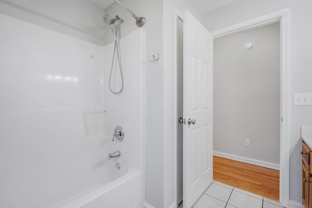 bathroom with shower / tub combination, tile patterned flooring, and vanity