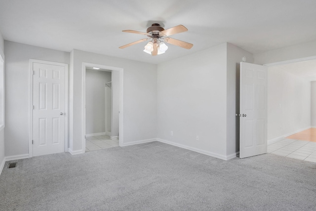 unfurnished bedroom with light carpet and ceiling fan