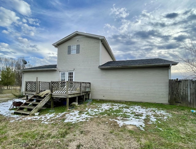 rear view of property with a wooden deck