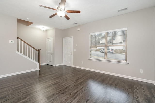 unfurnished room featuring ceiling fan and dark hardwood / wood-style flooring