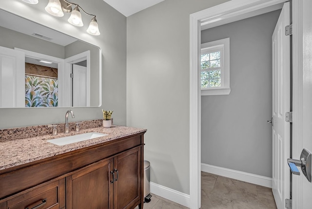 bathroom featuring tile patterned floors and vanity