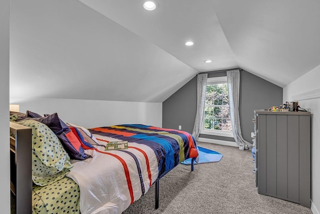 carpeted bedroom with vaulted ceiling