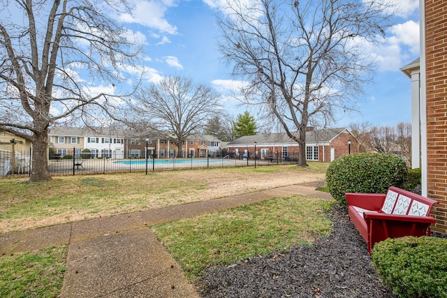 view of yard with a community pool