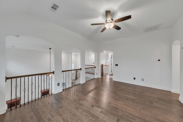 empty room featuring ceiling fan and hardwood / wood-style floors