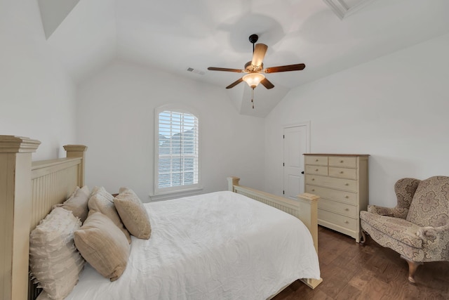 bedroom with vaulted ceiling, ceiling fan, and dark hardwood / wood-style flooring