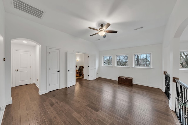 unfurnished living room featuring ceiling fan, lofted ceiling, and dark hardwood / wood-style floors