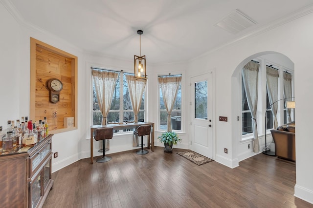 entryway featuring dark hardwood / wood-style floors and crown molding