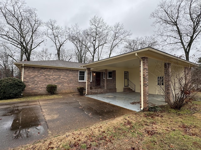 rear view of house with a carport