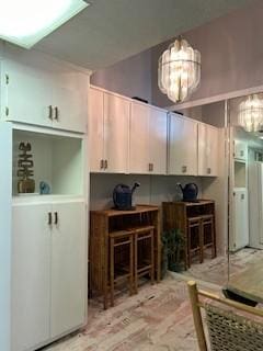 kitchen with a notable chandelier