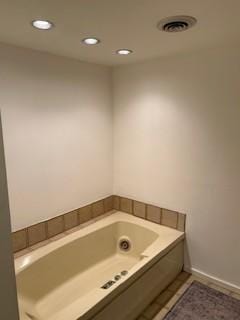 bathroom featuring a bathing tub and tile patterned floors