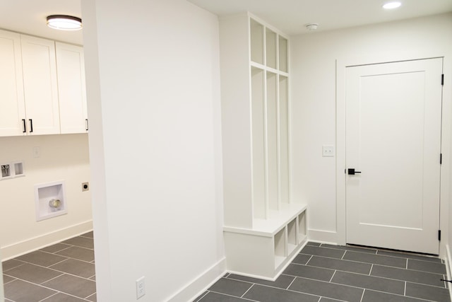 mudroom featuring dark tile patterned flooring