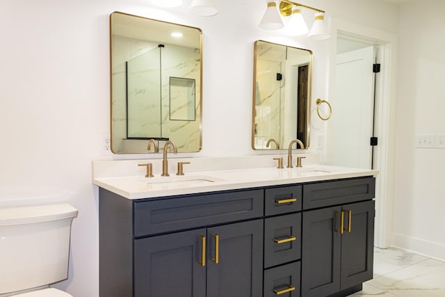 bathroom with vanity, toilet, and a shower with shower door