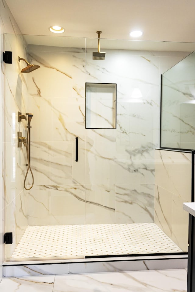 bathroom with an enclosed shower and vanity