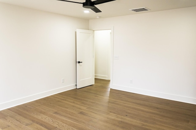 spare room featuring hardwood / wood-style floors and ceiling fan