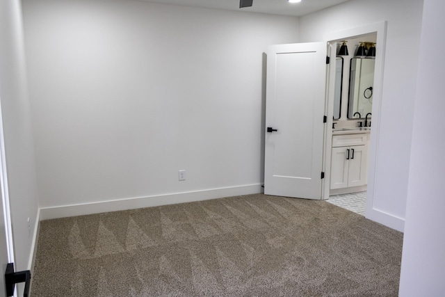 empty room featuring light colored carpet