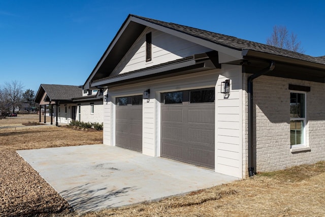 view of side of property with a garage