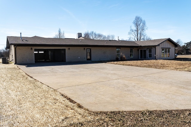 single story home featuring a carport and central air condition unit