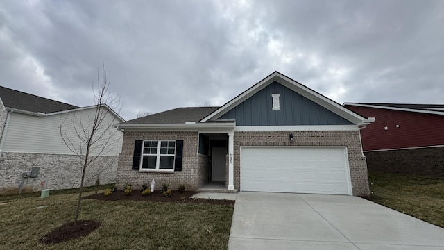 view of front of home featuring a garage and a front lawn