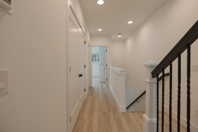 hall with light hardwood / wood-style floors