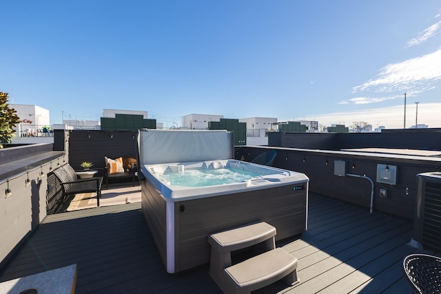 wooden terrace with central AC and a hot tub