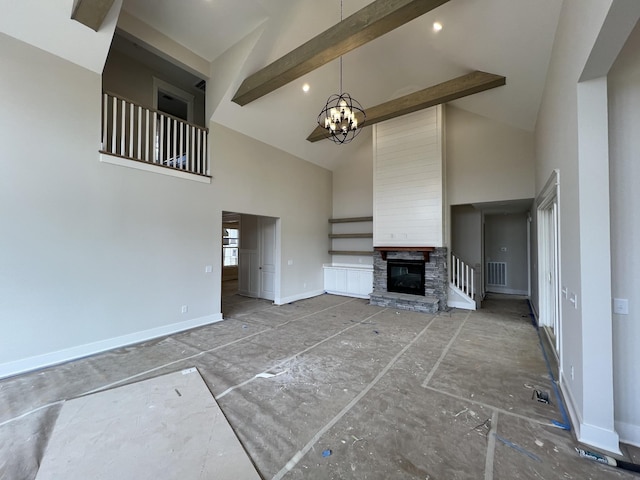 unfurnished living room featuring a chandelier, beam ceiling, visible vents, and baseboards