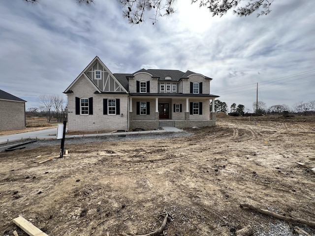 view of front of home featuring brick siding