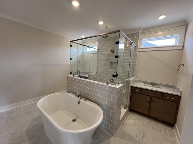 full bathroom featuring a freestanding tub, recessed lighting, vanity, baseboards, and a stall shower