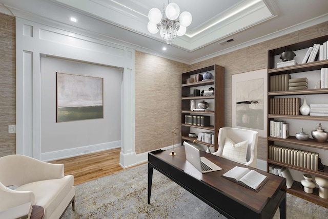 home office featuring crown molding, a chandelier, and light hardwood / wood-style floors