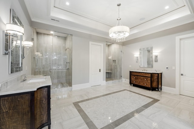 bathroom with walk in shower, a raised ceiling, and vanity