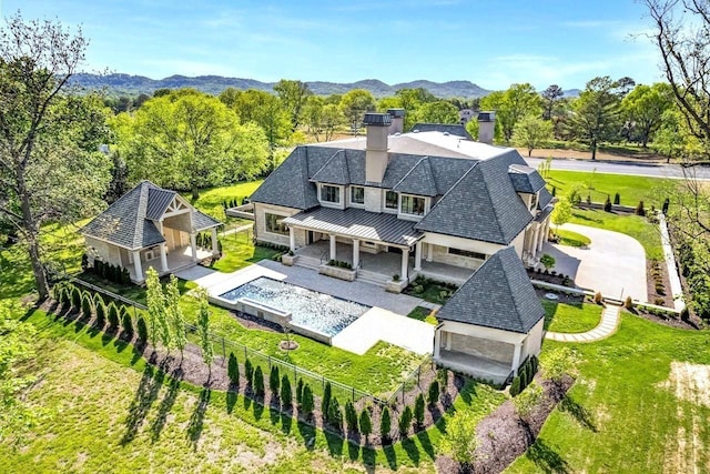 birds eye view of property with a mountain view