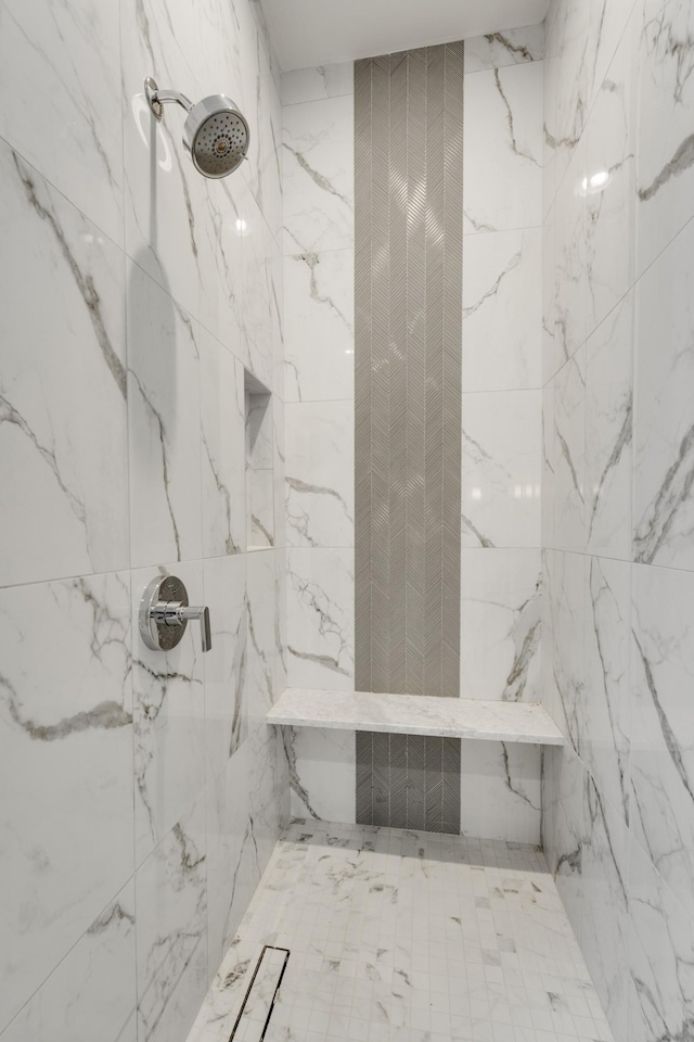 bathroom with tiled shower