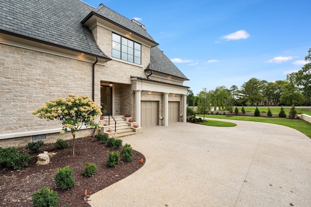 view of side of home with a garage