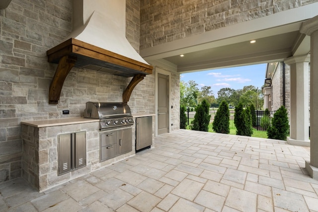 view of patio / terrace with area for grilling and exterior kitchen