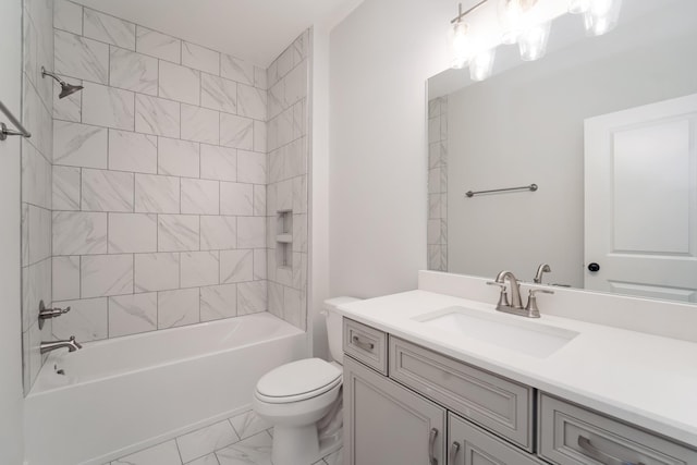 full bathroom featuring toilet, tiled shower / bath combo, and vanity