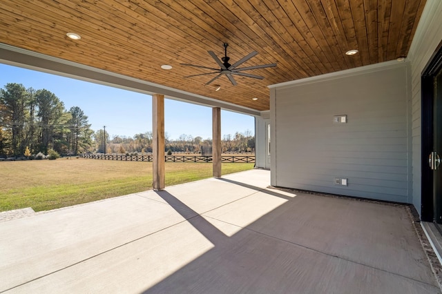 view of patio / terrace featuring ceiling fan and a rural view