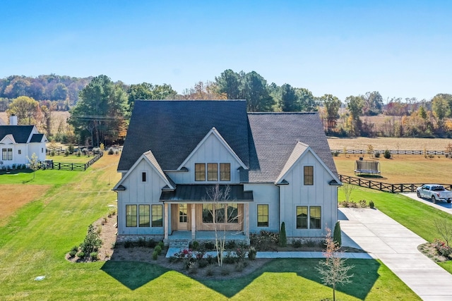 back of property featuring a porch and a lawn